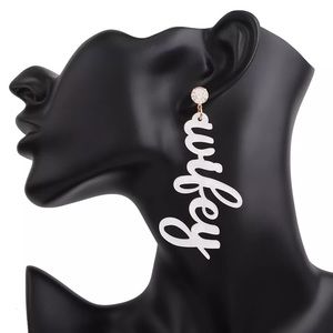 White transparent wifey earrings